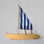 Handmade wooden toy sailboat with blue and white fabric sail | Salt Air Supply