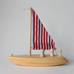 Handmade wooden toy sailboat with red and white fabric sail | Salt Air Supply