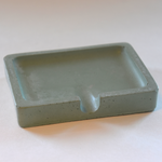 This fun green colored bar soap holder has a minimal design and would look great near any sink